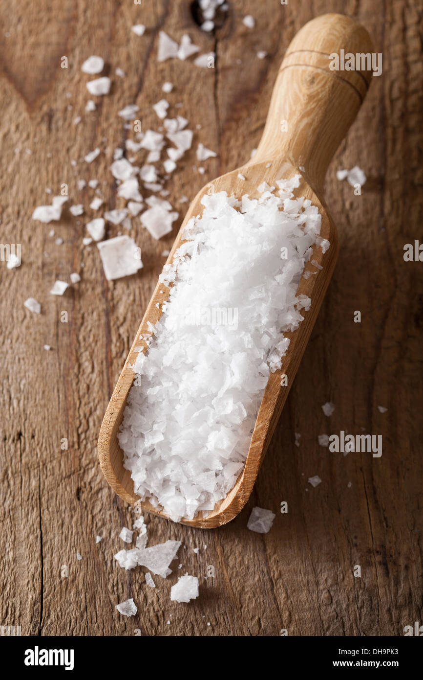 sea salt in wooden scoop Stock Photo