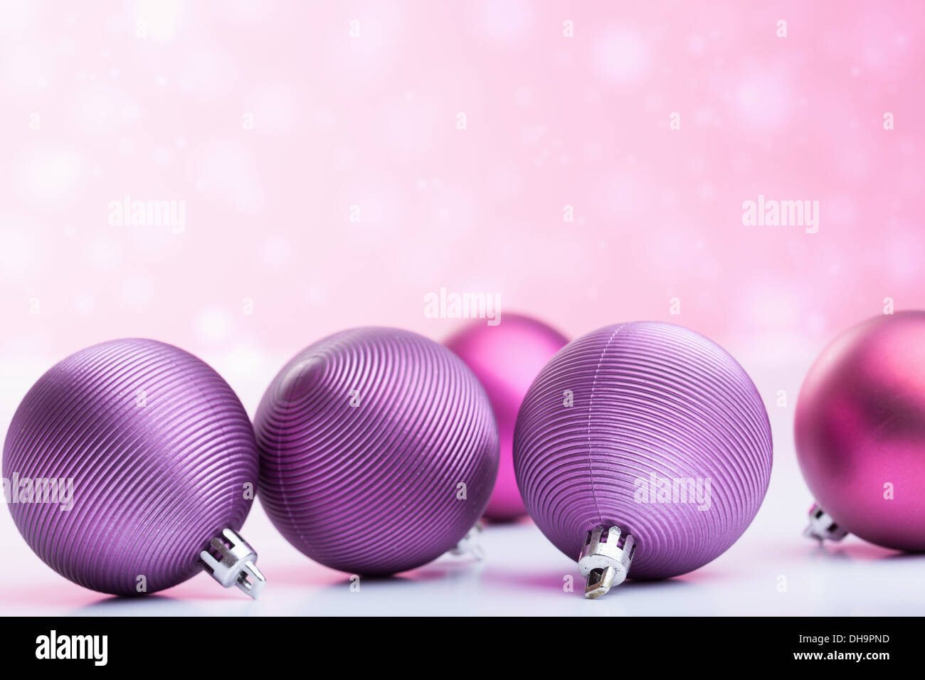 purple christmas balls over blurred background Stock Photo