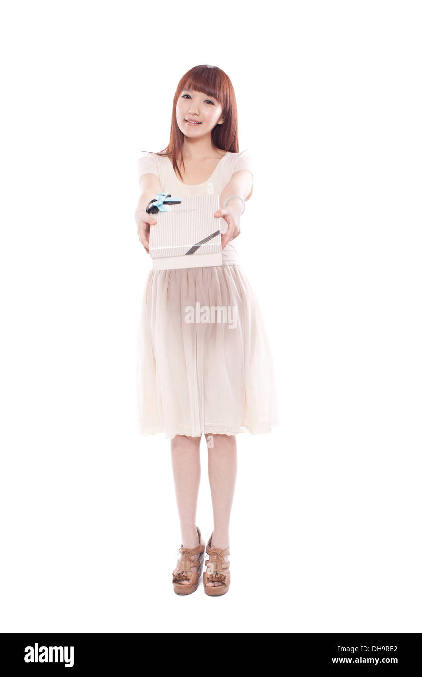 Young woman holding wrapped presents,smiling Stock Photo
