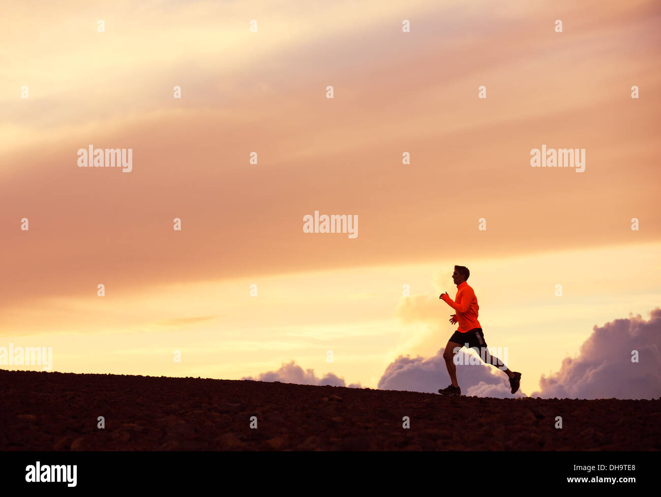 Male runner silhouette, Man running into sunset, colorful sunset sky ...