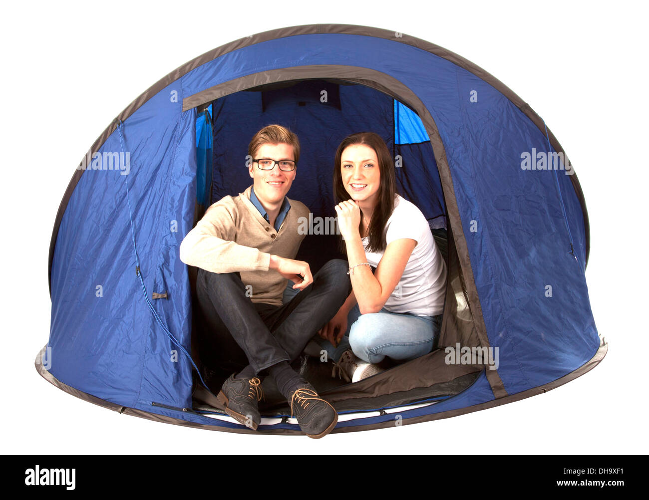 Happy couple in blue tent isolated on white background Stock Photo