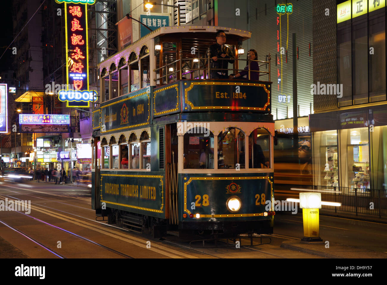 Double decker tram in Hong Kong city at night Stock Photo
