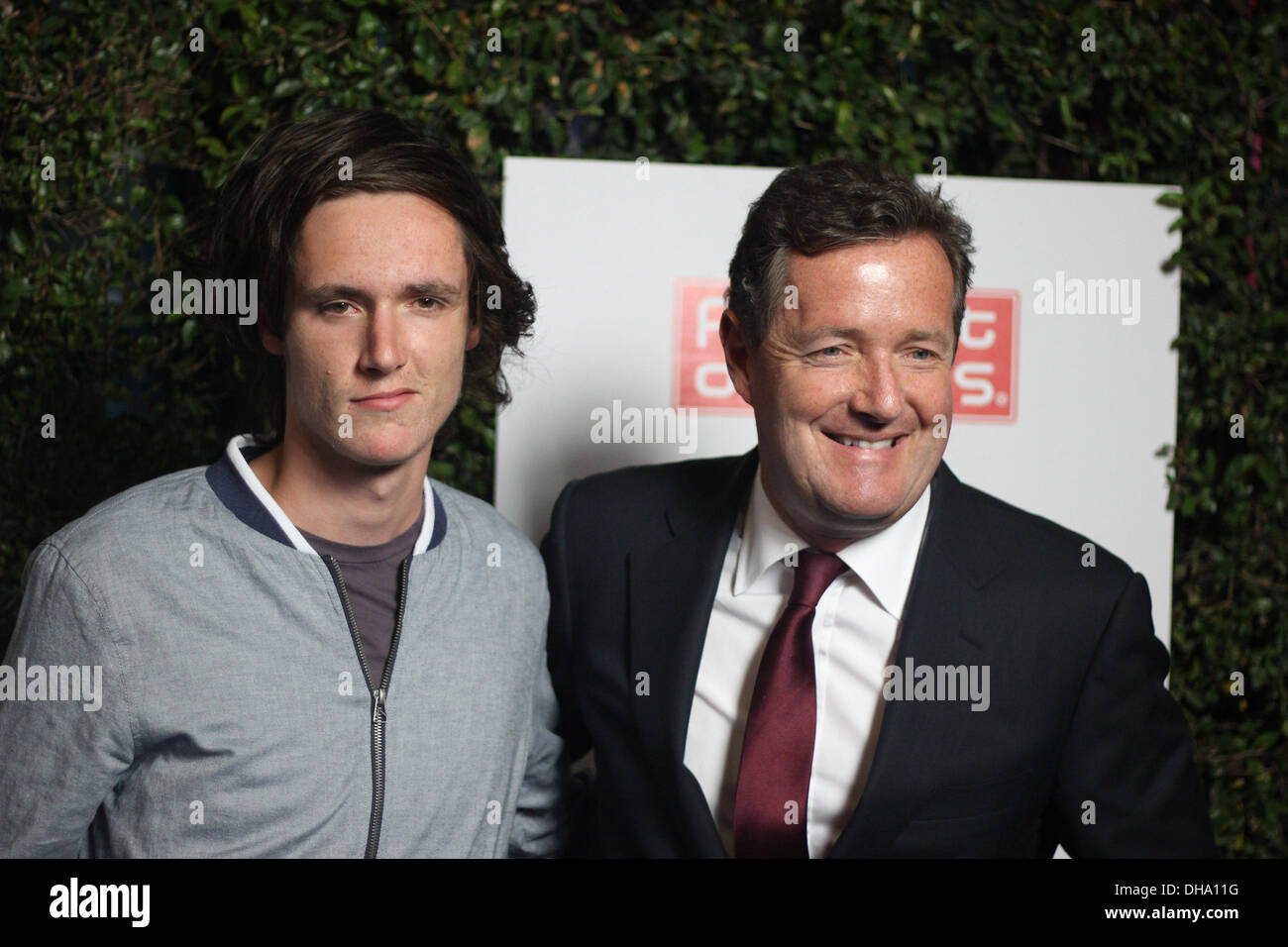 Piers Morgan and his son Spencer arriving at Grand Opening Of Robert Earl's Planet Dailies/Mixology 101 Los Angeles California Stock Photo
