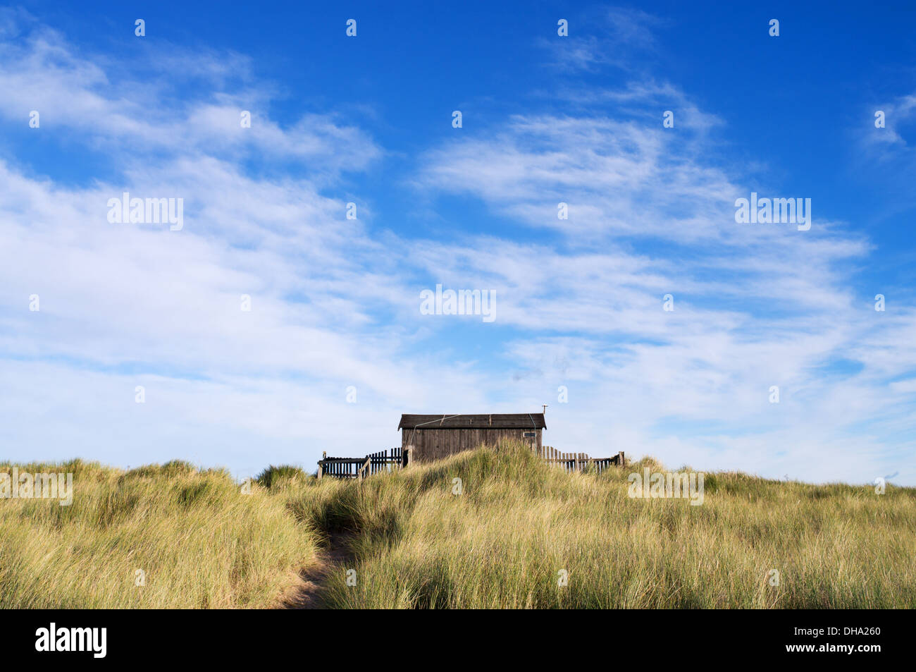 Remote National Trust warden's hut Beadnell Bay, Northumberland, England, UK Stock Photo