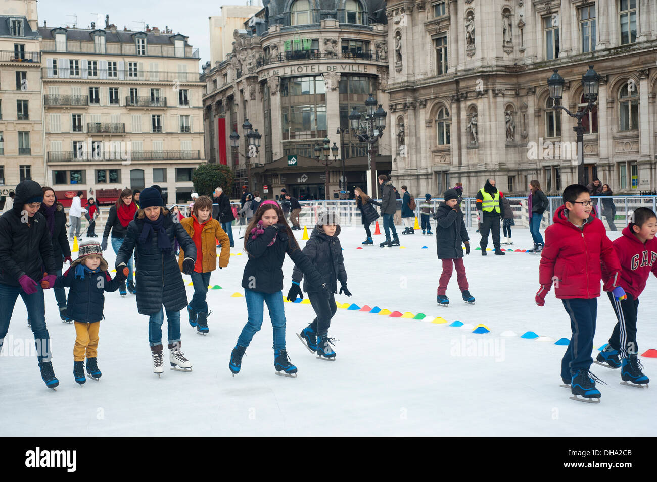Paris, France Young people ice skating at Hotel de Ville at Christmas time Stock Photo Alamy