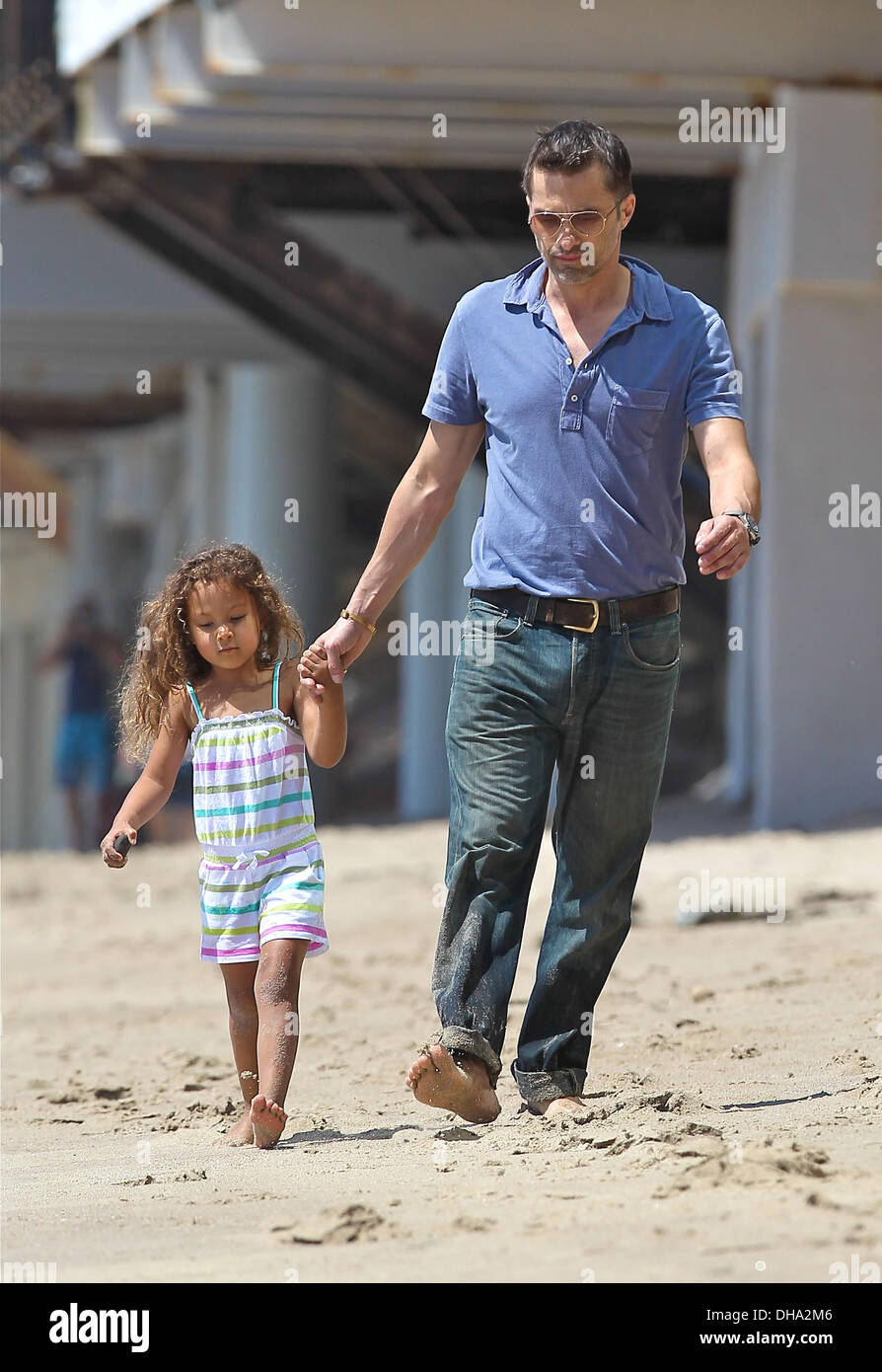 Olivier Martinez and his fiancee's daughter Nahla Aubry playing on Malibu Beach Los Angeles California - 07.04.12 Stock Photo