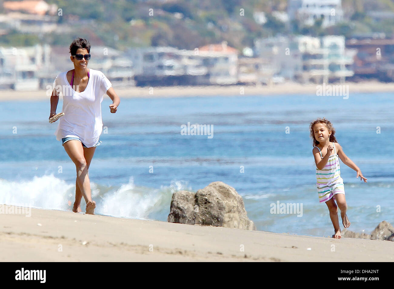 Halle Berry and daughter Nahla Aubry playing on Malibu Beach Los