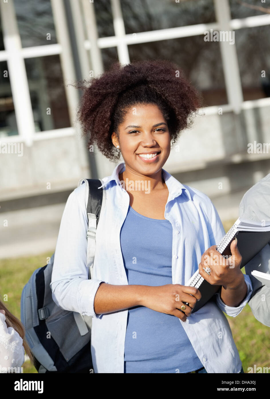 Female Student Holding Books On College Campus Stock Photo - Alamy
