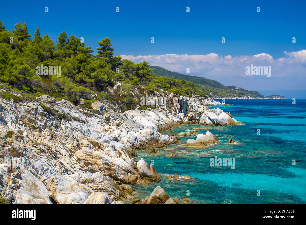 Rocky coastline and a beautiful clear water at Halkidiki Kassandra peninsula in Greece Stock Photo