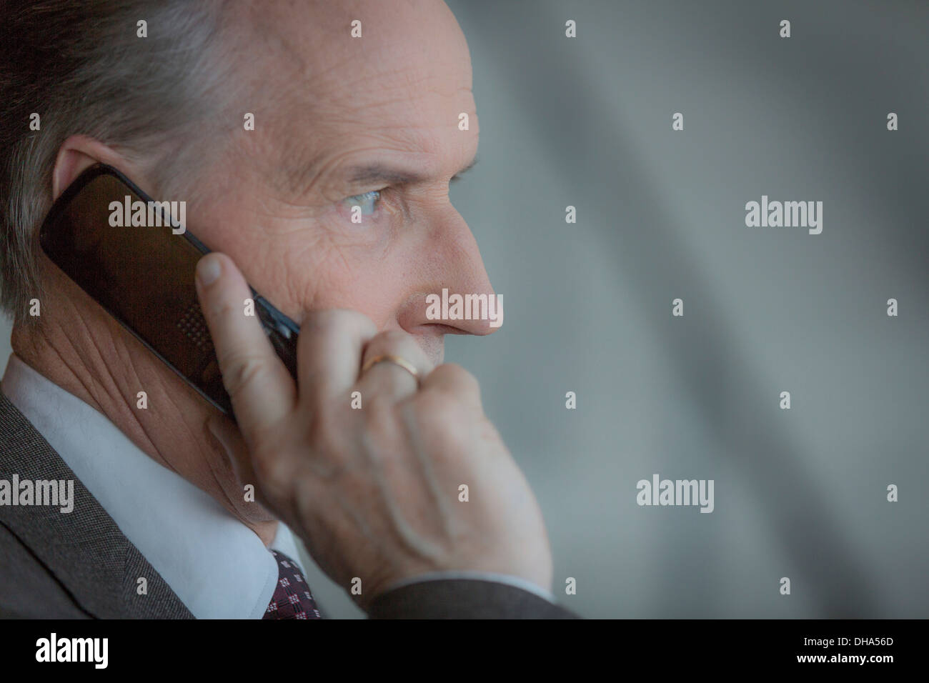Business man talking on a mobile phone Stock Photo