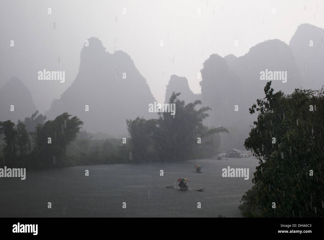 Boats On The River On A Rainy Day; Yangshuo, China Stock Photo