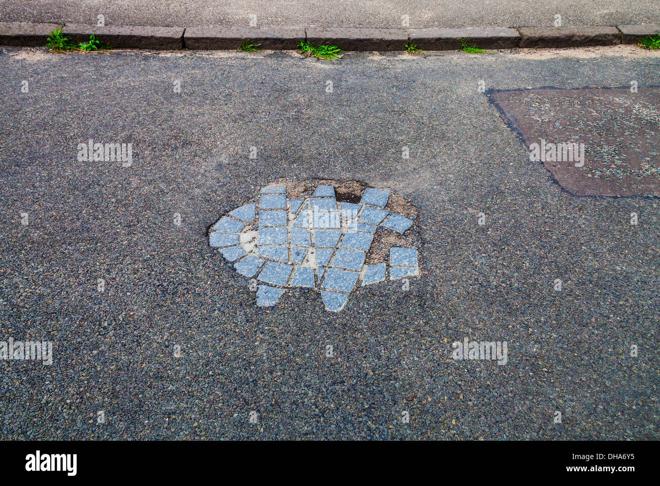 The initials GW mark the spot in the road in St Andrews,Scotland, where
