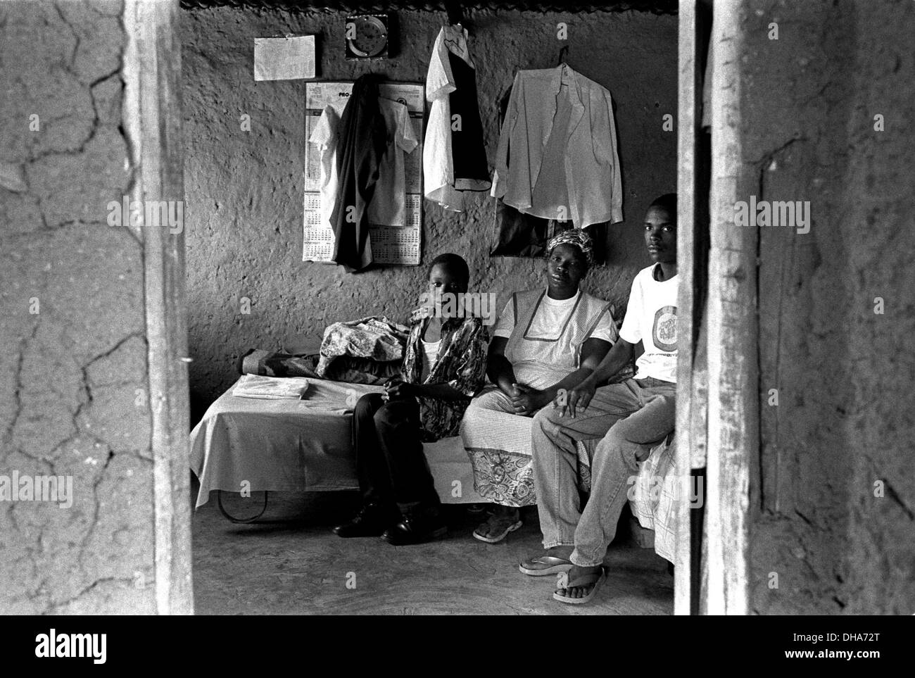 ipjr09090315Poverty and dignity. June 2004. Mother and sons in the origonal room of the family home.. Ms Mzila, is a single Stock Photo