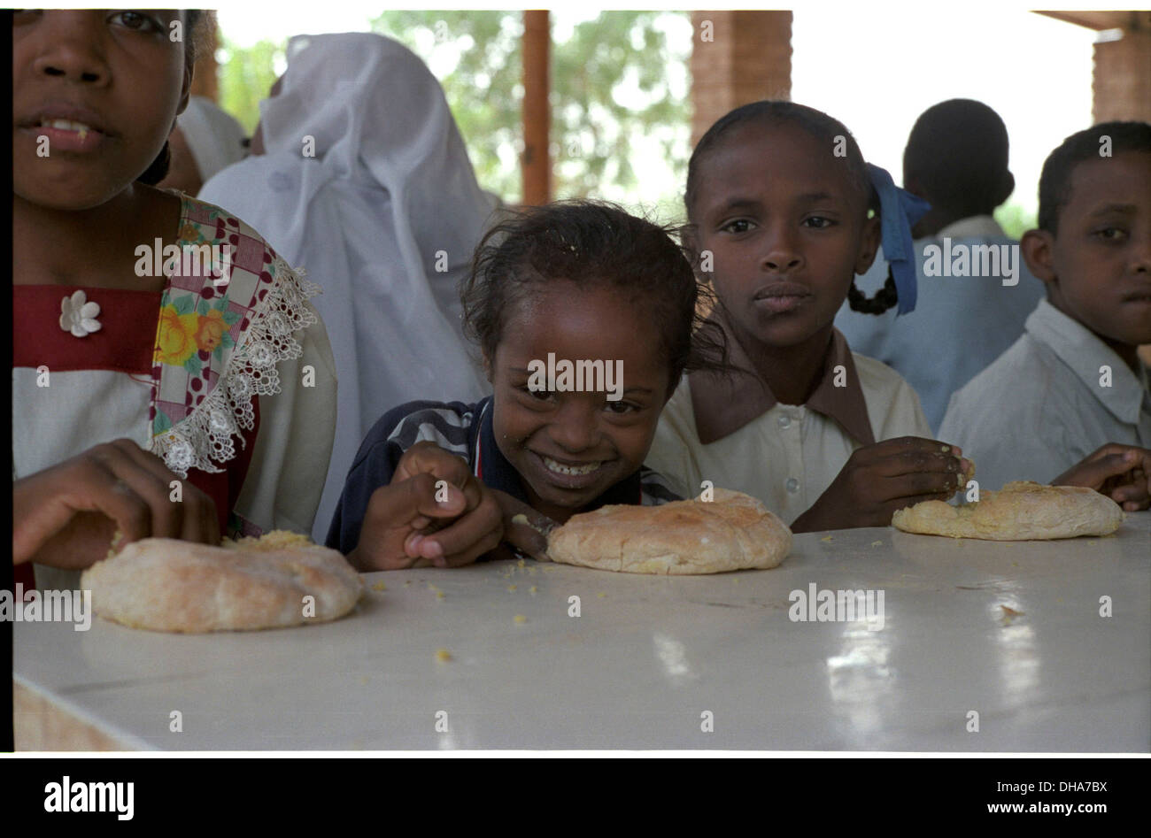 ipjr09440905aSeptember 2004 Athbarah Nahr An Nil SudanChildren at the institute recieve a breakfast, many would have not eaten Stock Photo