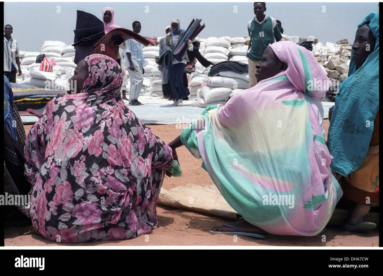 ipjr0944030aSeptember 2004 Otach IDP Camp Nyala Janub Darfur SudanWomen waiting for material relief at Otach IDP Camp.. An IDP Stock Photo
