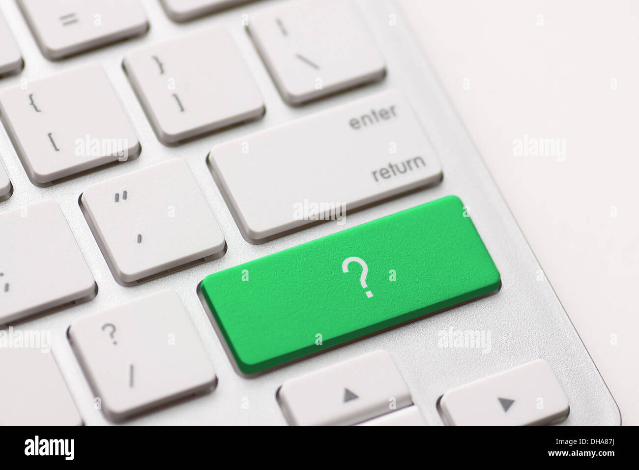 question enter button key on white keyboard Stock Photo