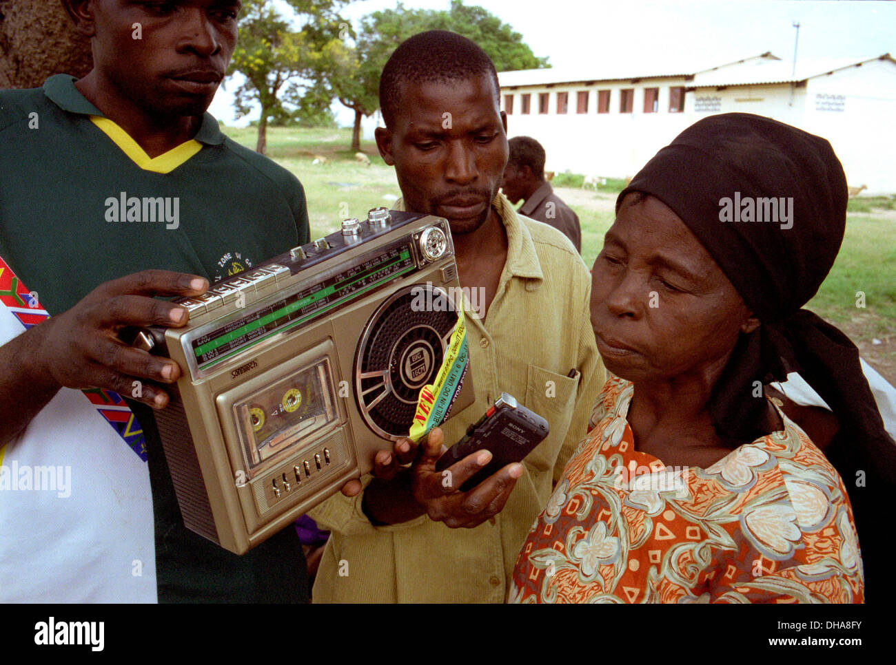 Listening to the radio in africa hi-res stock photography and