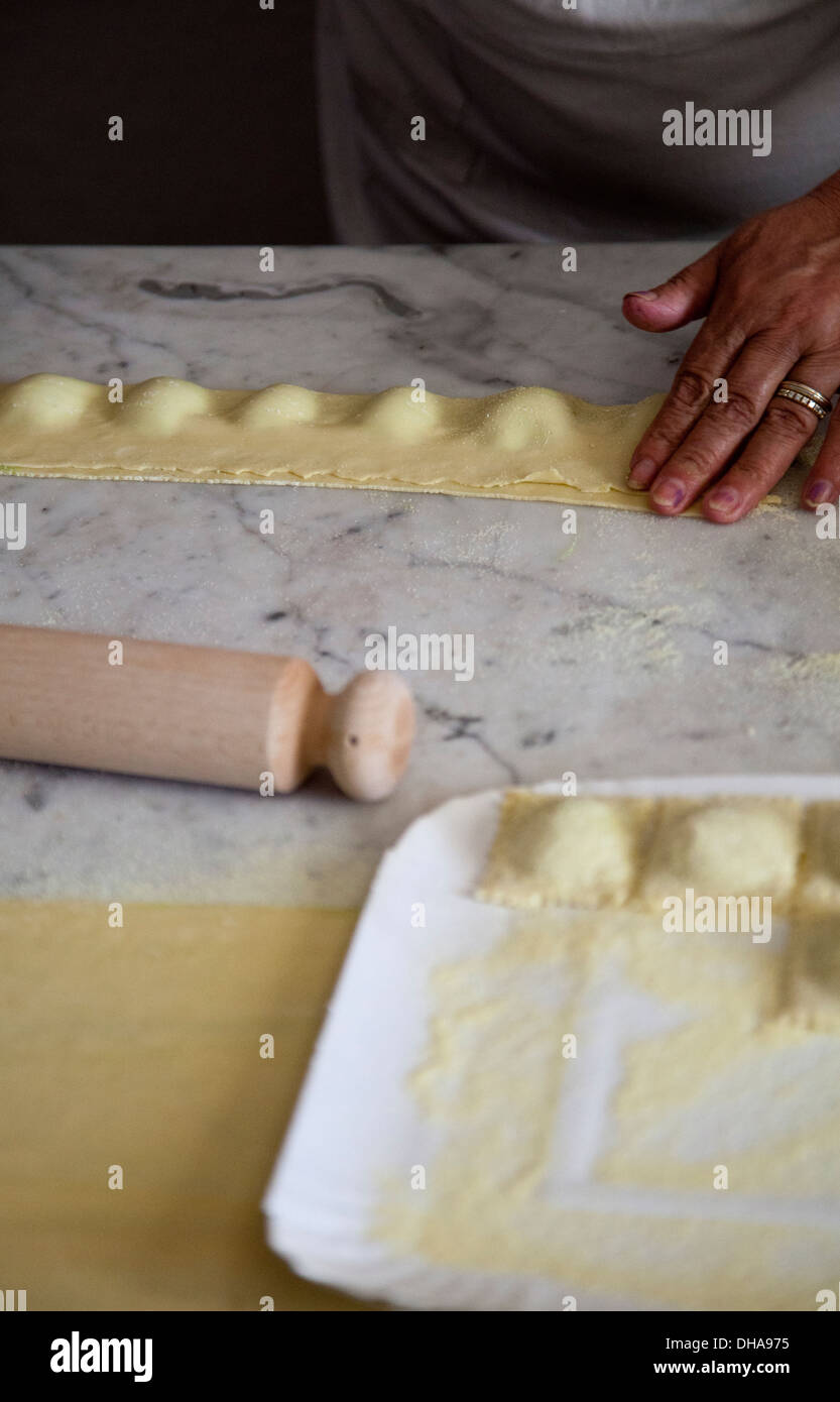 Woman Preparing Fresh Ravioli Parcels Stock Photo