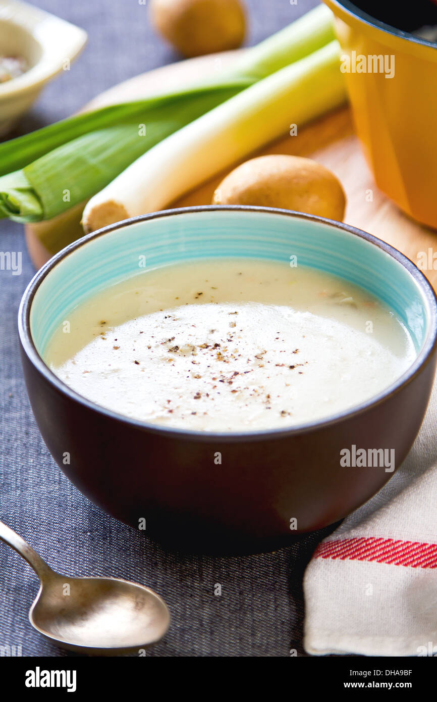 Leek and Potatoes soup by bread and fresh ingredients Stock Photo
