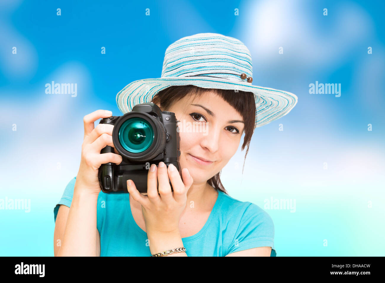 Pretty woman is a professional photographer with dslr camera Stock Photo