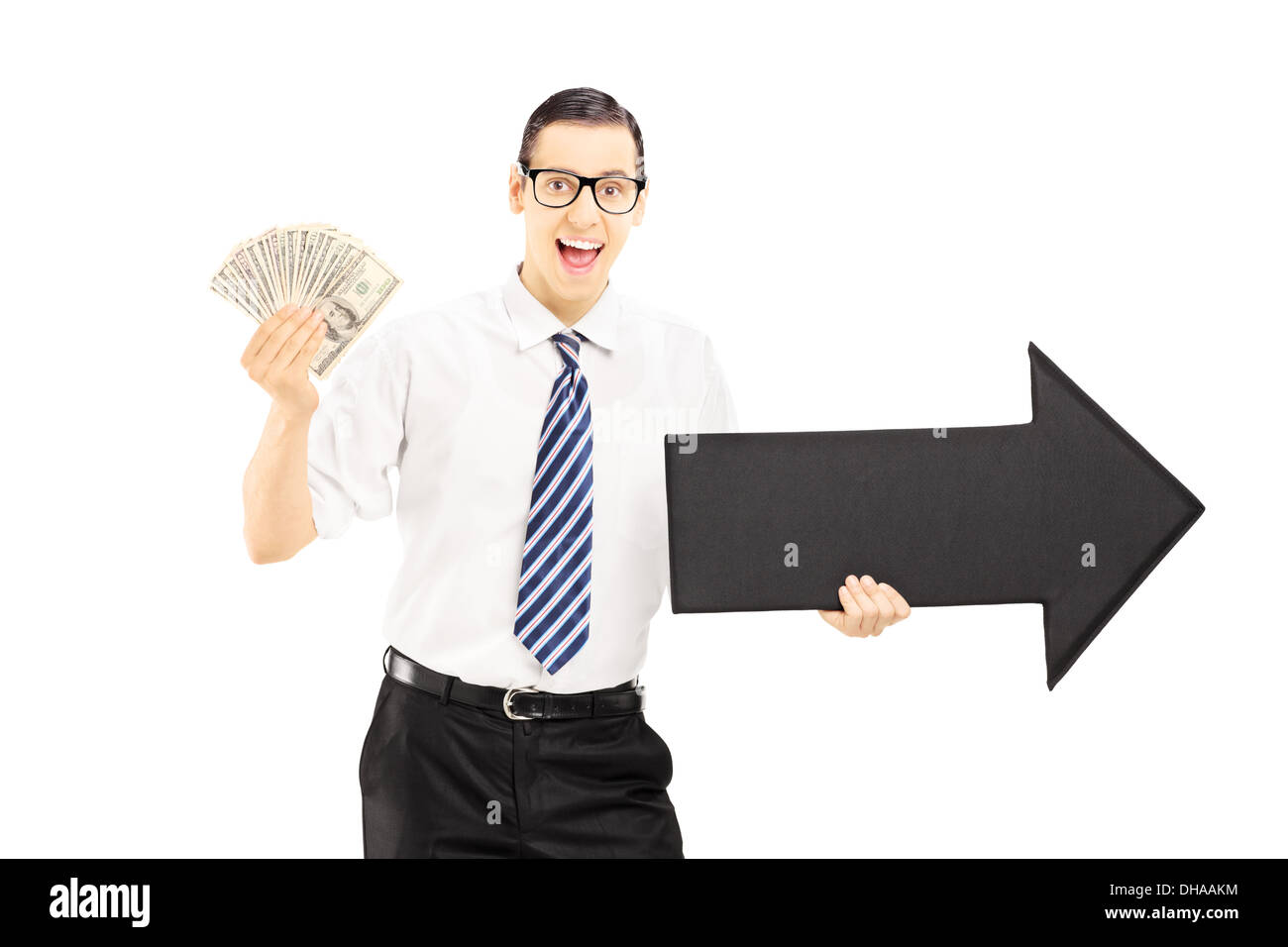 Young excited businessman holding a big black arrow pointing to the ...