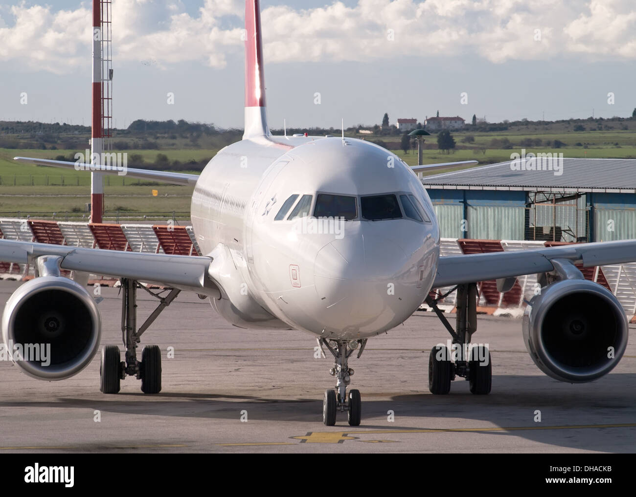 front view of commercial airplane on airport Stock Photo