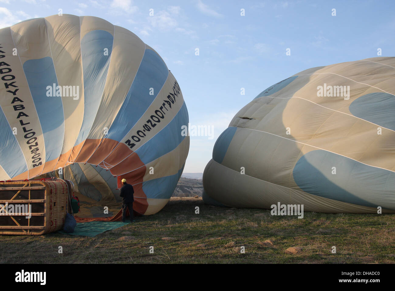 Balloons being inflated before flight over Cappadocia in Turkey at dawn Stock Photo