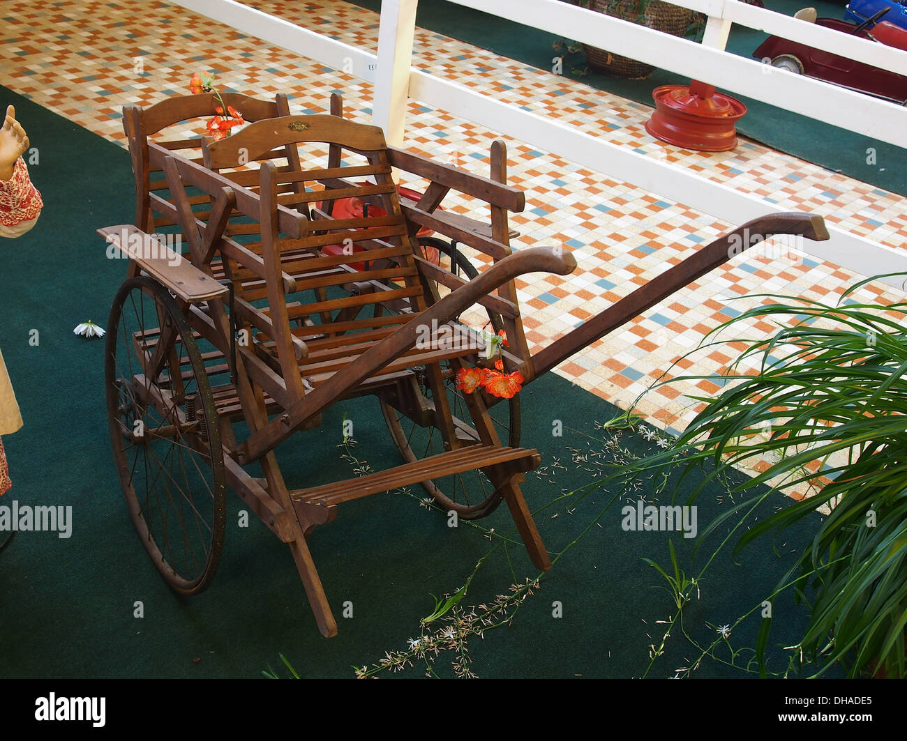 An old rickshaw is part of the automobile collection at the Museum of ...