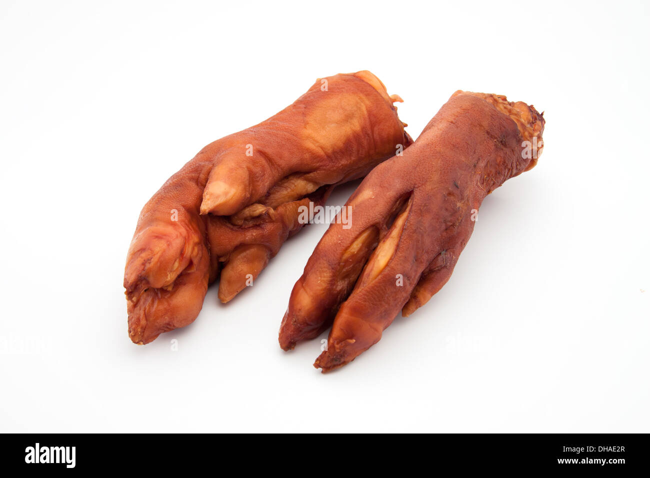 Dry smoked pork  trotters on white background Stock Photo