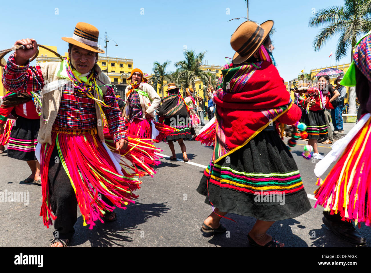 Indians in traditional peruvian dresses dancing in the square Plaza de Armas, Lima, Peru Stock Photo