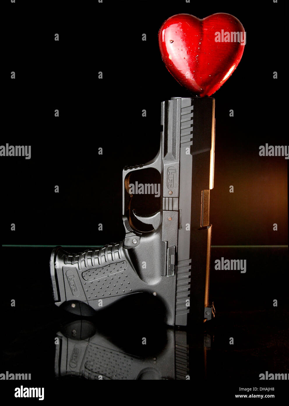 Gun and heart Stock Photo Alamy