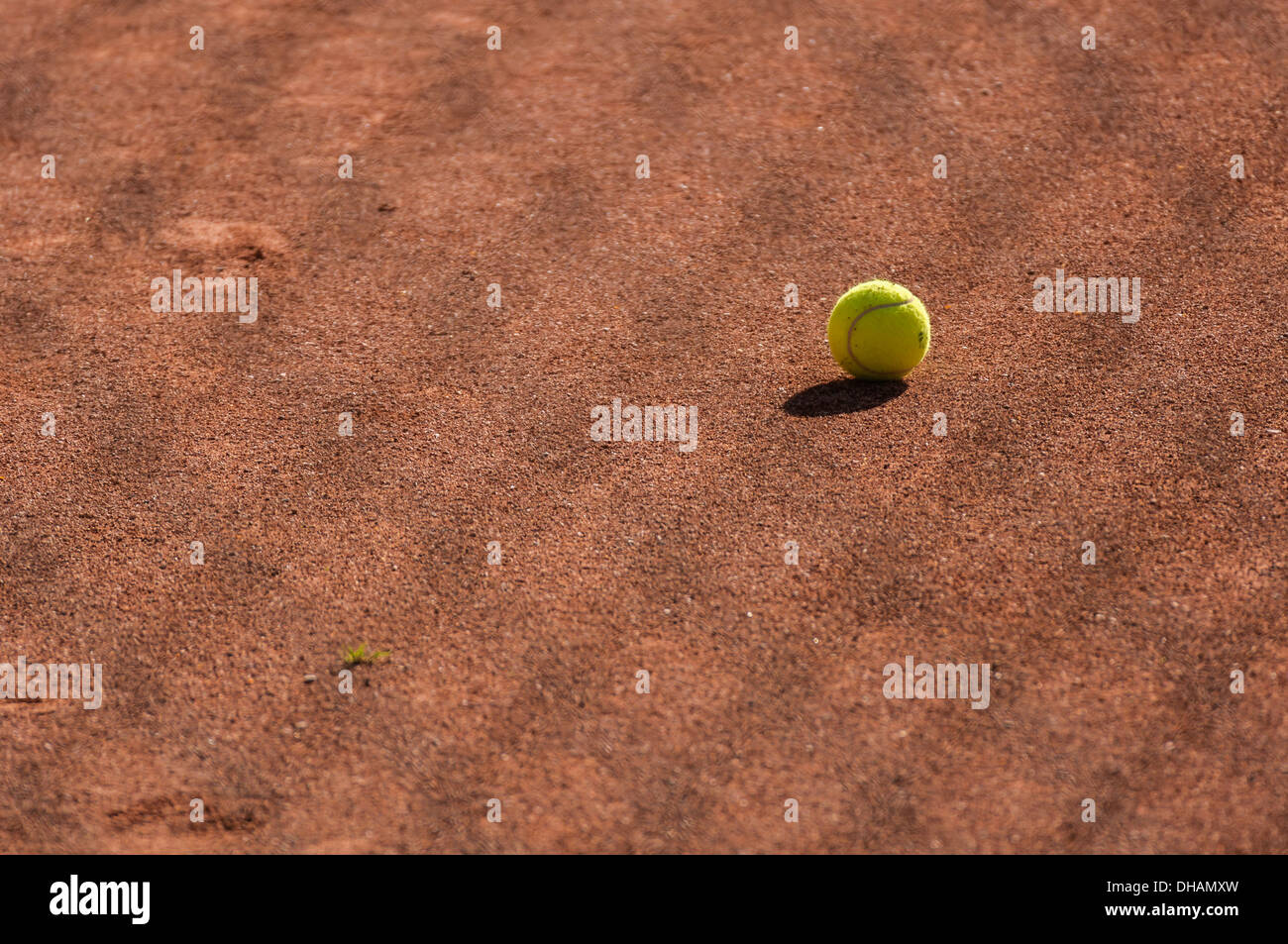 Tennis ball on the red clay Stock Photo