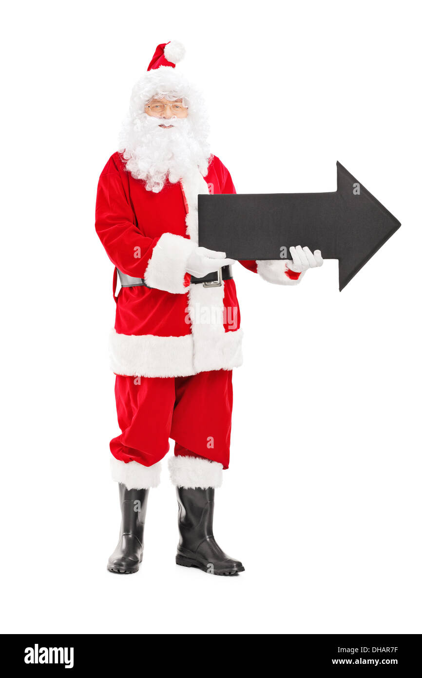 Full length portrait of a smiling Santa Claus holding a big black arrow ...