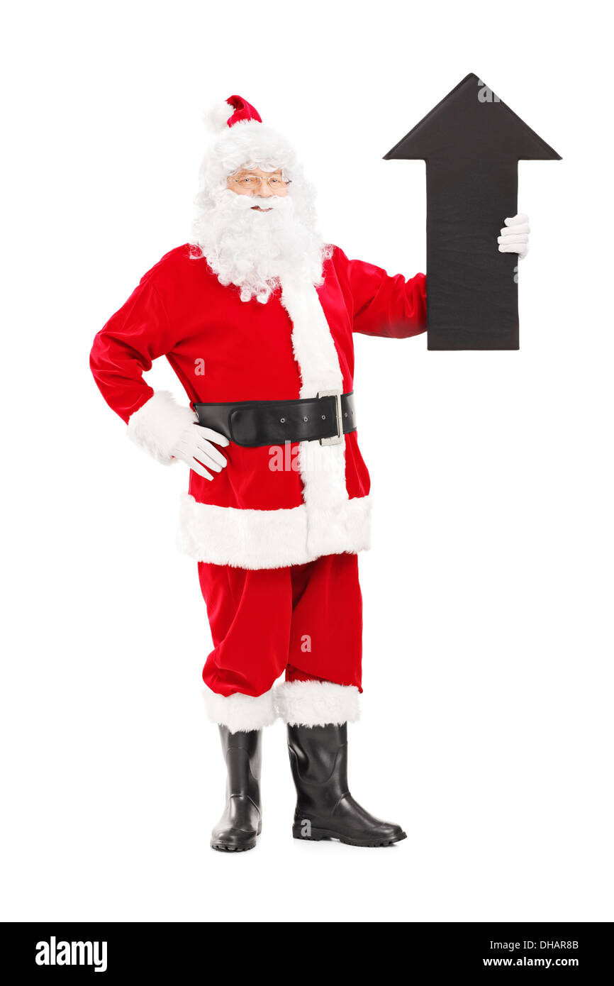 Full length portrait of a smiling Santa Claus holding a big black arrow ...