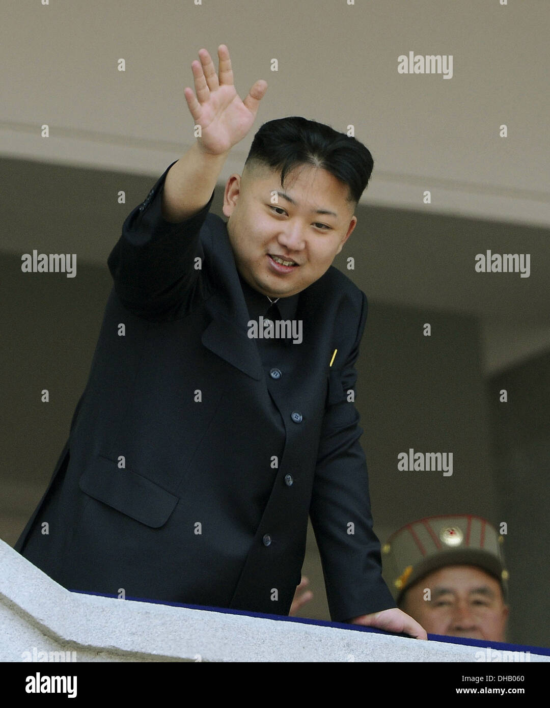 rth Korean leader Kim Jong Un ackwledges crowd from a balcony during a