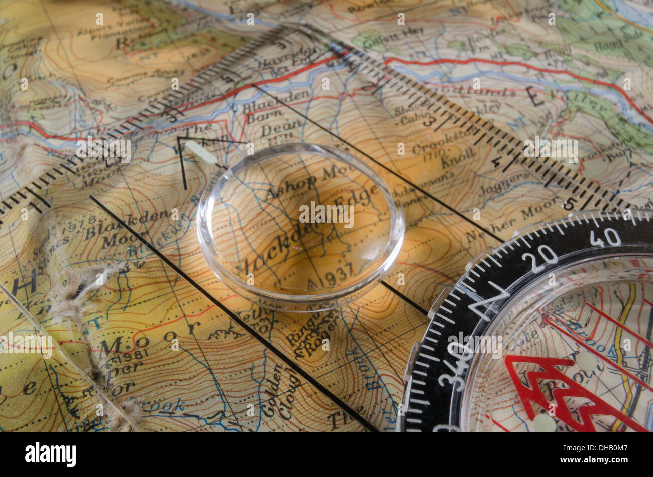 classic compass on colorful map preparing for journey with lots of ...