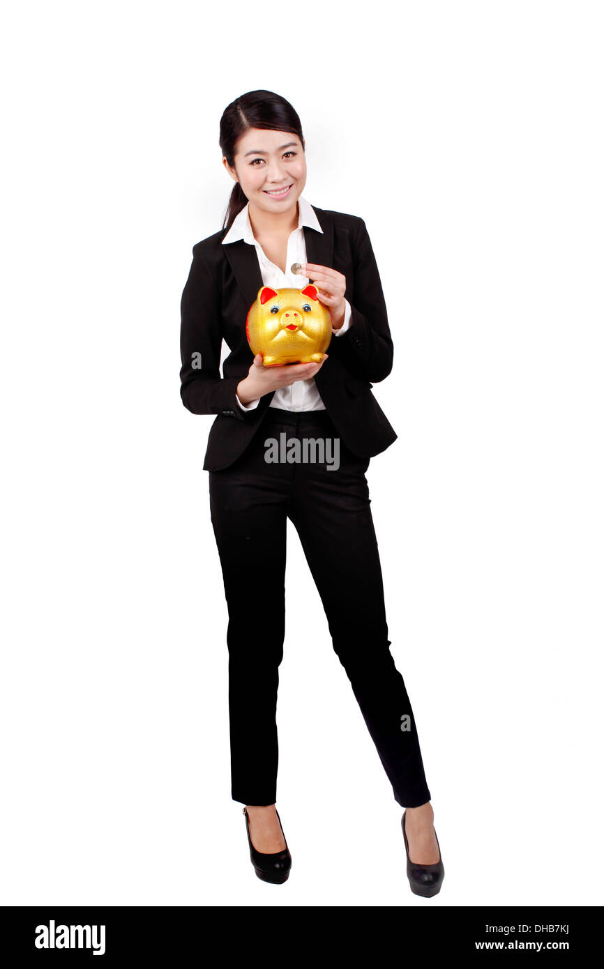 Businesswoman holding a piggy bank Stock Photo - Alamy