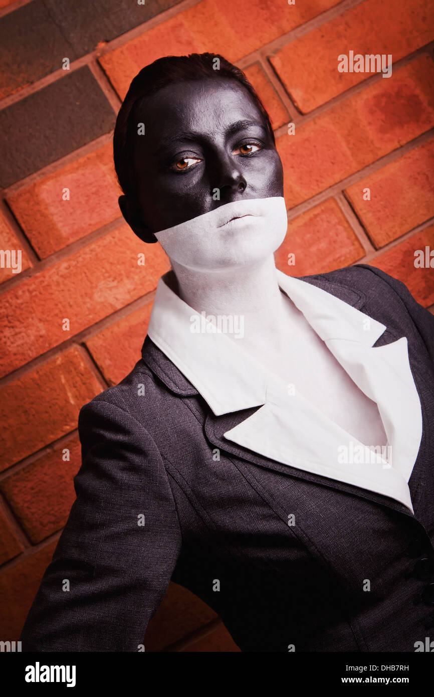 A Woman Is Painted In Black And White To Mask Physical Characteristics And To Create An Androgynous Feel; Edmonton, Alberta Stock Photo