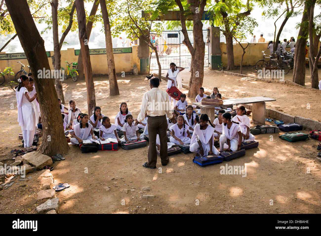 Rural Indian village high school girls and teacher in an outside class. Andhra Pradesh, India Stock Photo