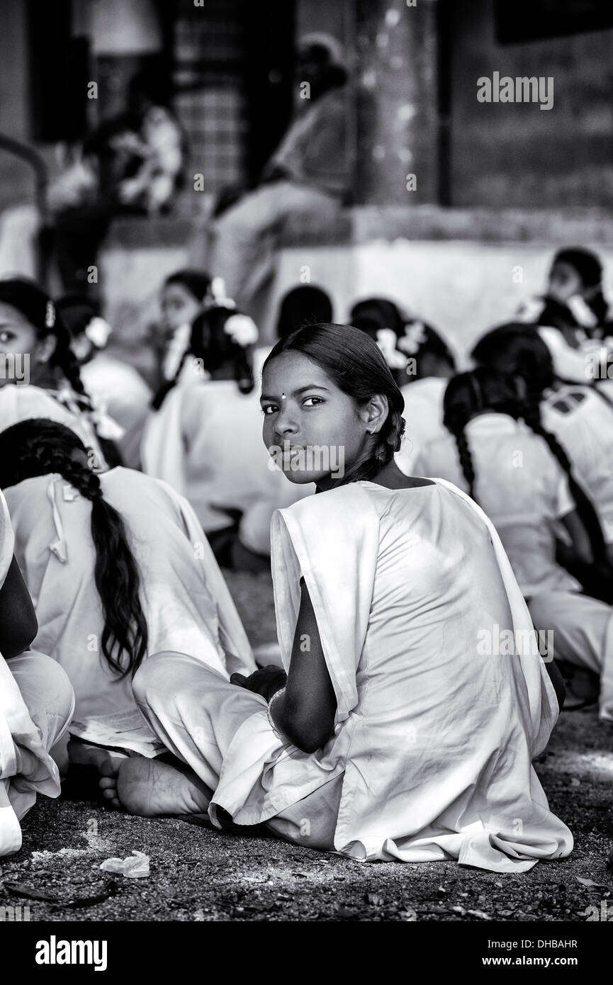 Rural Indian village high school girl in an outside class. Andhra Pradesh, India. Monochrome Stock Photo