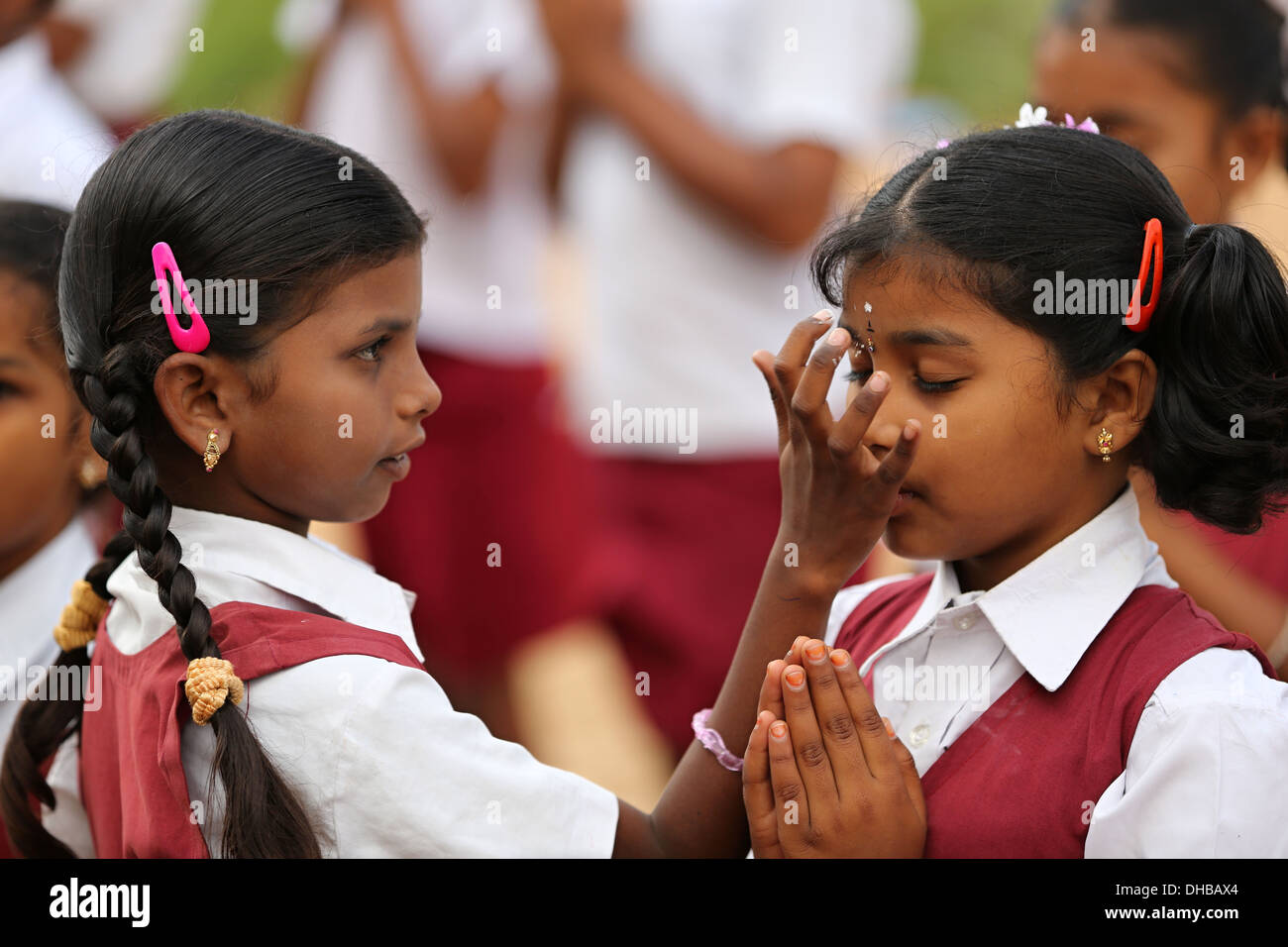 Indian school children chanting and applying vibhuti Andhra Pradesh South India Stock Photo