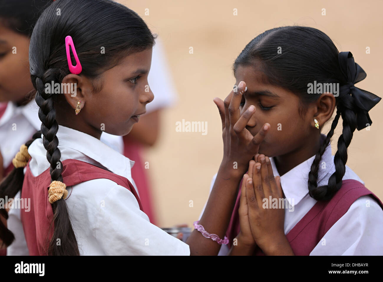 Indian school children chanting and applying vibhuti Andhra Pradesh South India Stock Photo