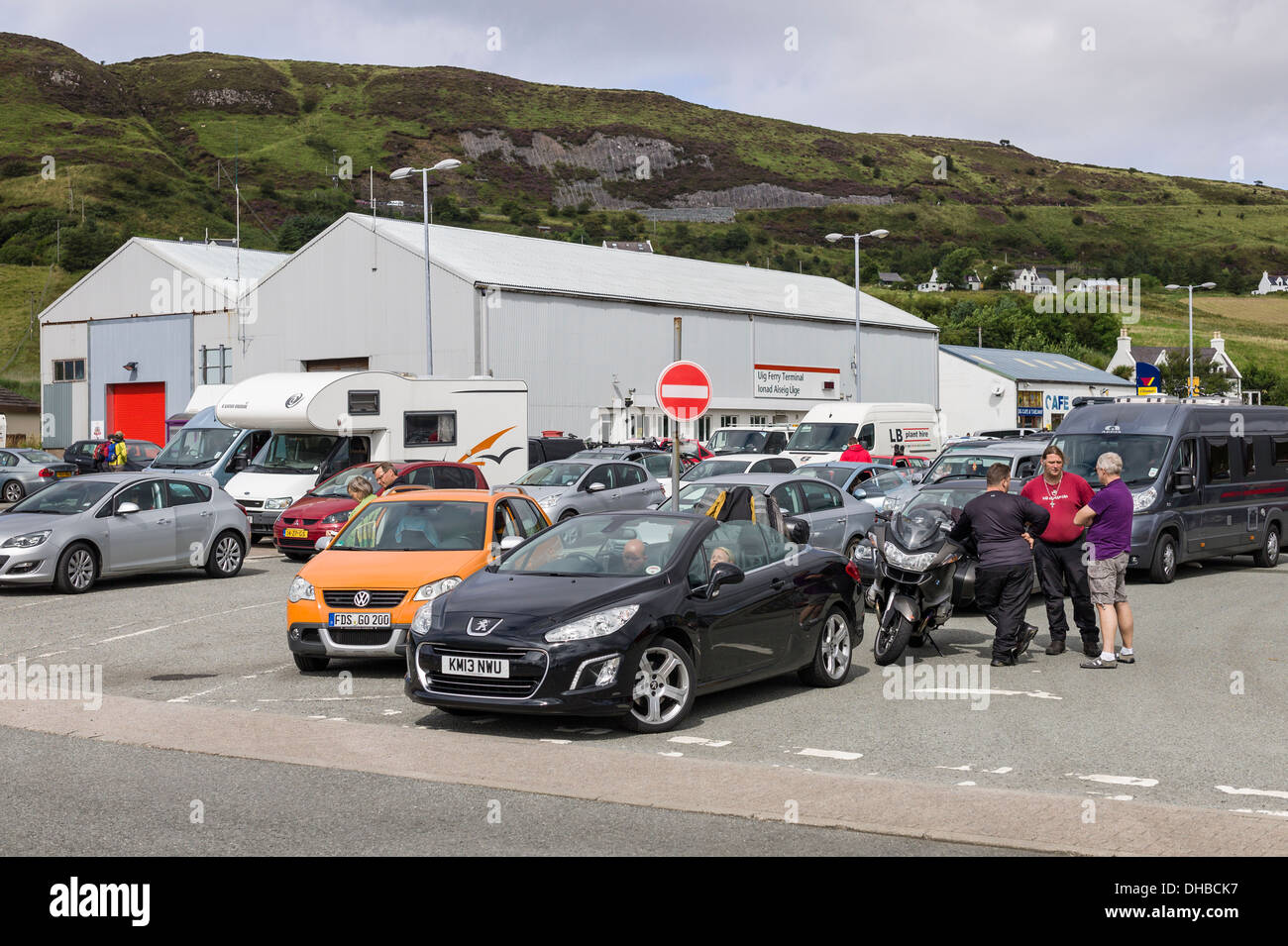 Traffic in lines awaiting arrival of ferry boat at UIG on Isle of Skye UK EU Stock Photo