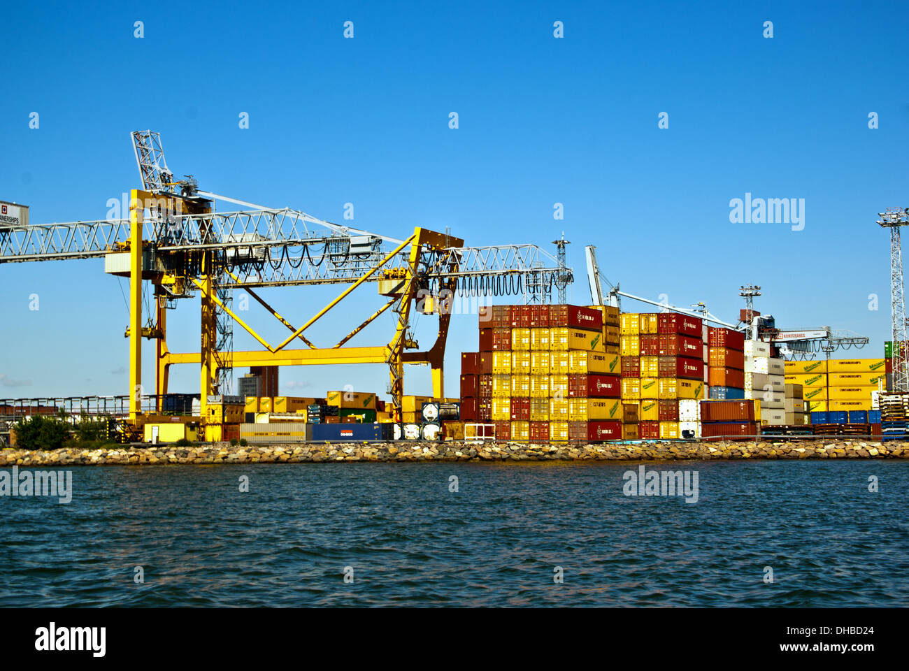container crane and stacked shipping containers Stock Photo