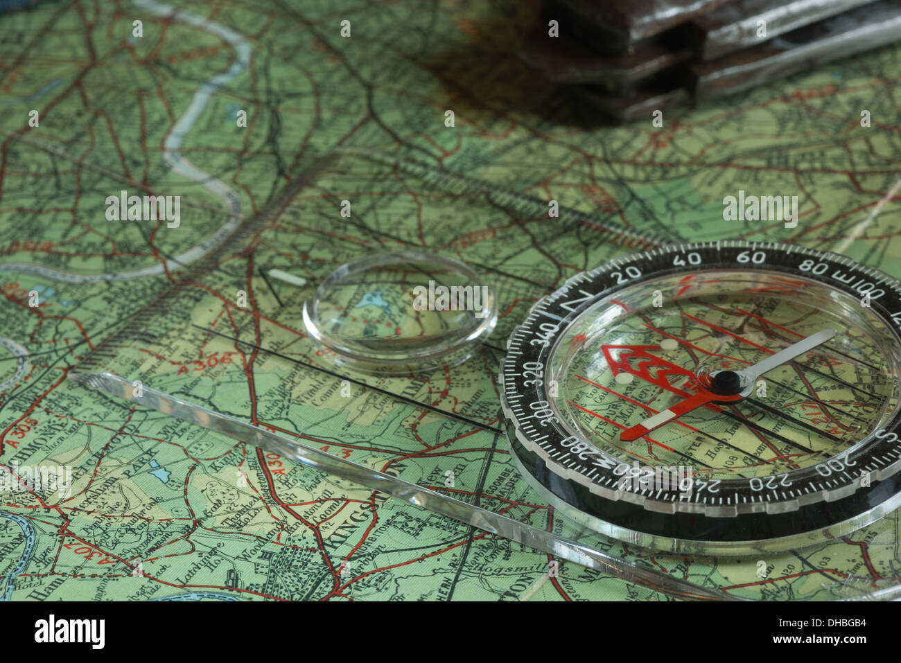 classic compass on colorful map preparing for journey with lots of ...