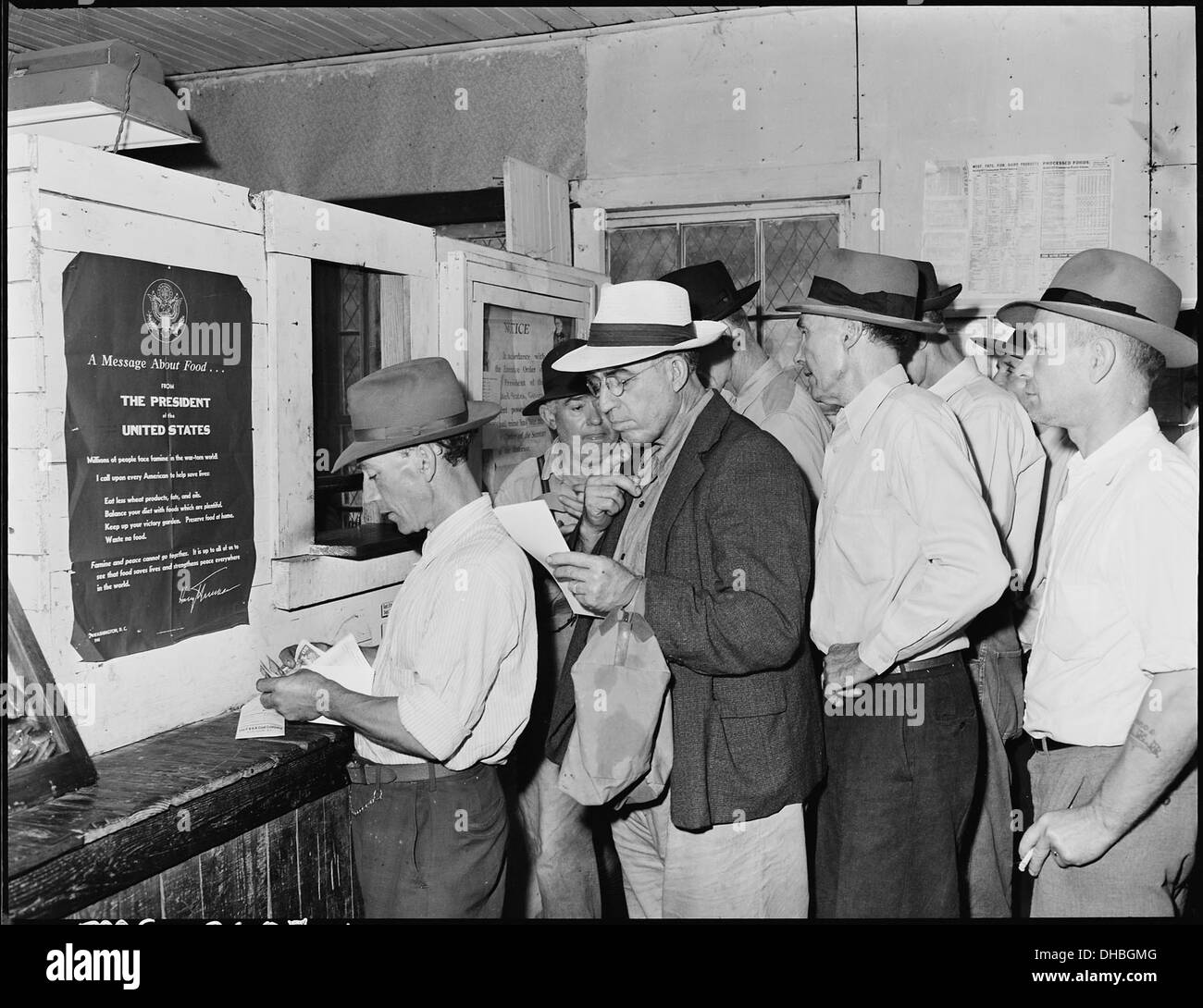Blaine Sergent, third in line, at the pay window. P V & K Coal Company, Clover Gap Mine, Lejunior, Harlan County... 541332 Stock Photo