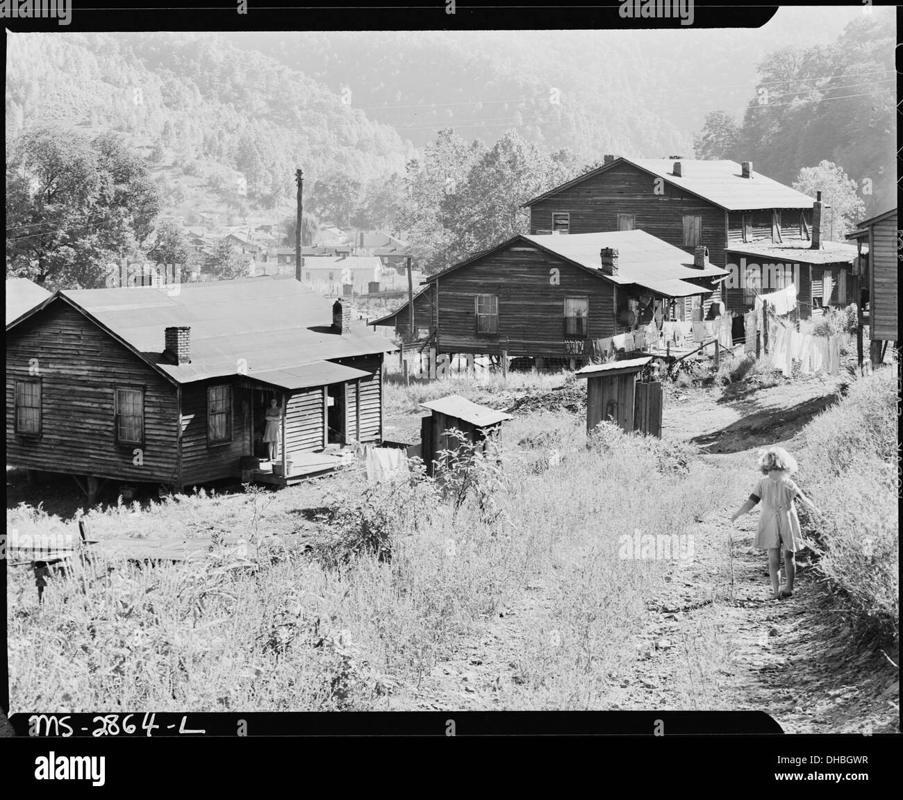 Bobbie Jean Sergent on the road below her house. P V & K Coal Company, Clover Gap Mine, Lejunior, Harlan County... 541392 Stock Photo