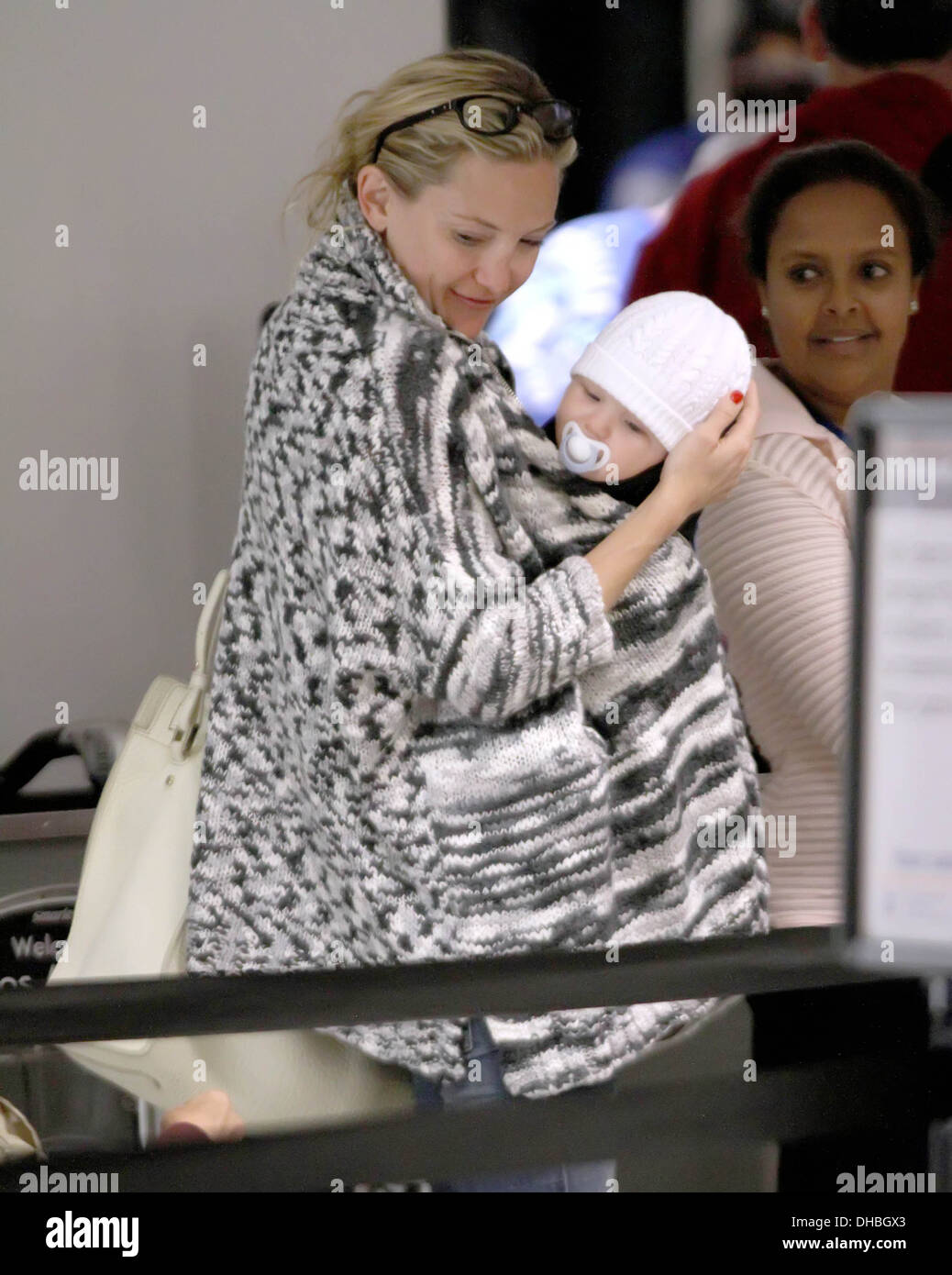Kate Hudson cuddles up with her son Bingham as baby boy and her stylish