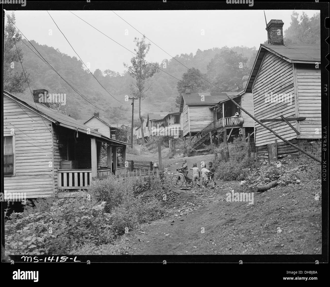 Children playing among typical houses. Gilliam Coal and Coke Company
