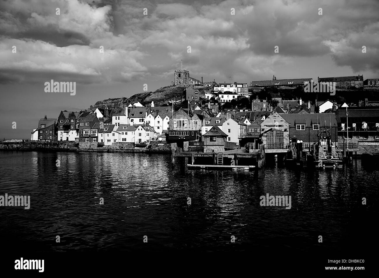 Black and white image of the harbour in the seaside town of Whitby, North Yorkshire, England. Stock Photo